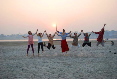 Jumping for joy after playing cricket until sunset.